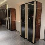 Rounded-Corner Dark Wood Wine Cabinet with Tinted Glass Doors Quilted Beige Upholstered Panels and Interior Shelving